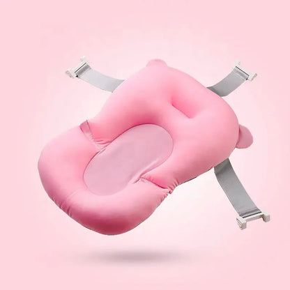 'Baby bath cushion supporting newborn during bath'