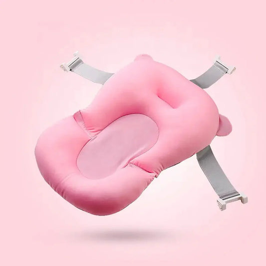 'Baby bath cushion supporting newborn during bath'